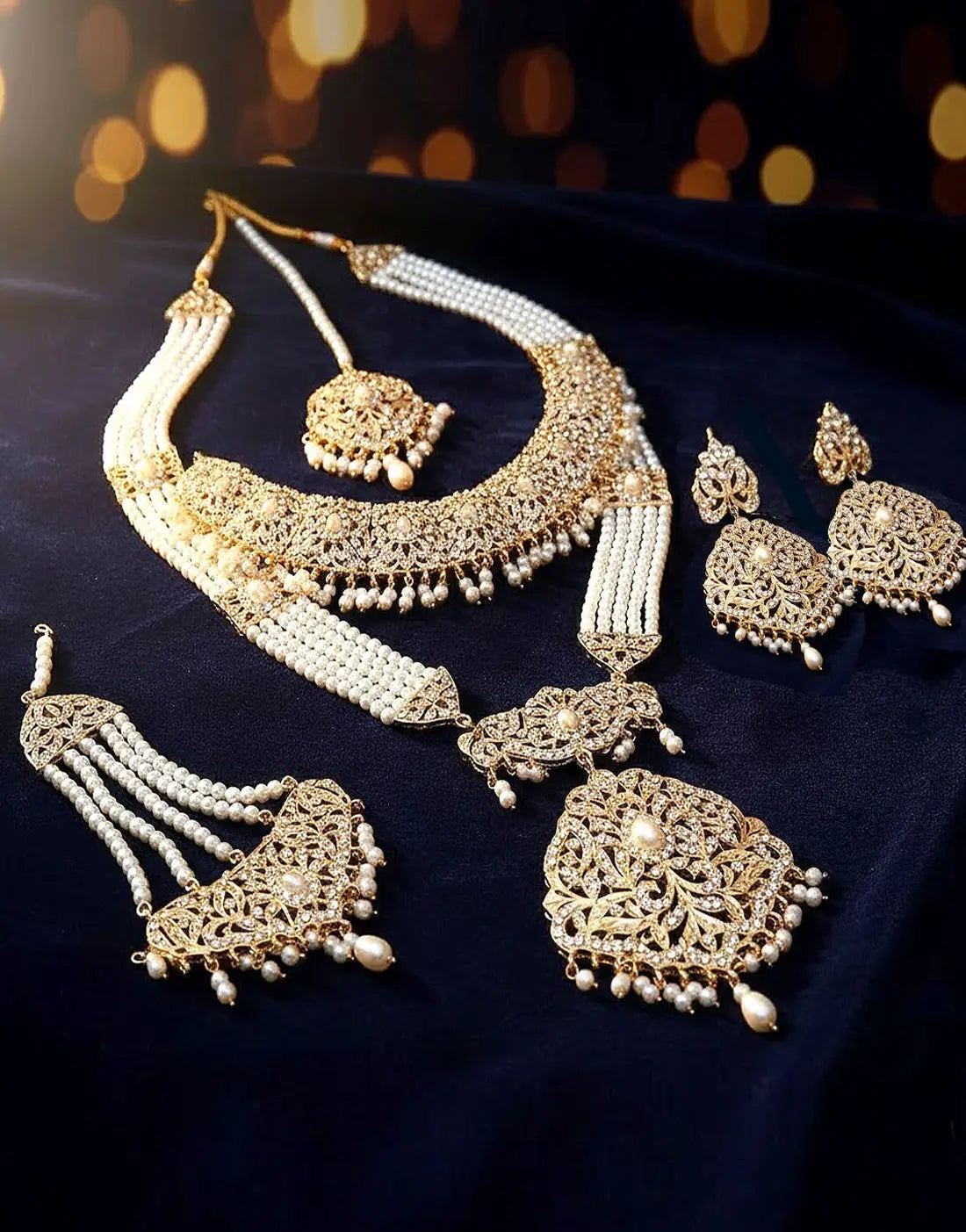 Luxurious Hyderabadi Pearl Mala Bridal Jewellery Set with Choker, Earrings, Jhumar and Maang Tikka