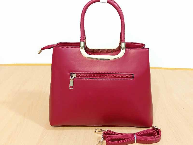 High Quality Faux-Leather Ladies Maroon Handbag with Hanging Pom Pom